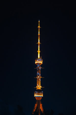 asian landmark television illuminated TV tower at night in Tashkent in Uzbekistan on background of dark night skyの写真素材