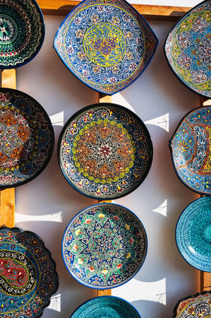 Uzbek ceramic plates hand-painted at oriental street bazaar in Uzbekistan in Tashkent