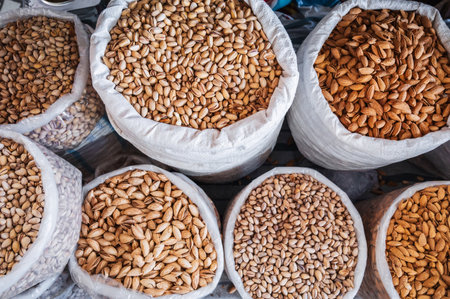 assortment of different varieties of almonds and pistachios in bags at Uzbek Chorsu bazaar in Tashkent in Uzbekistanの写真素材
