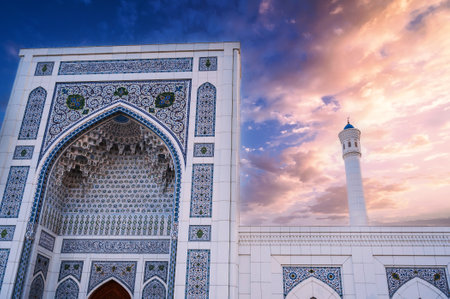 marble wall decorated uzbek ornaments and white minaret of new Islamic Minor Mosque in Tashkent in Uzbekistan on background of beautiful skyの写真素材