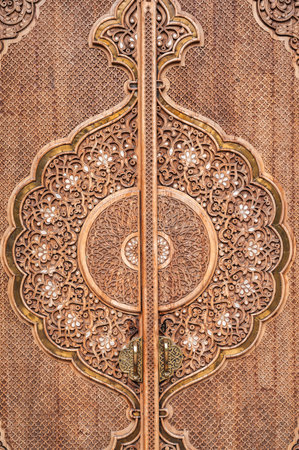 oriental pattern Uzbek traditional ornament on wooden carved door in Museum of Political Repression in Tashkent in Uzbekistan close-upの写真素材