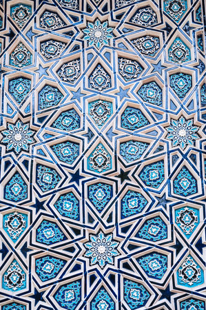 ceramic tile uzbek mosaic with Arabic Islamic pattern decorated with blue and white starry ornament...