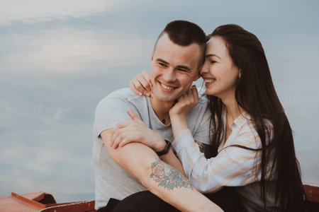 boyfriend and girlfriend hugging in the summer on the beachの写真素材