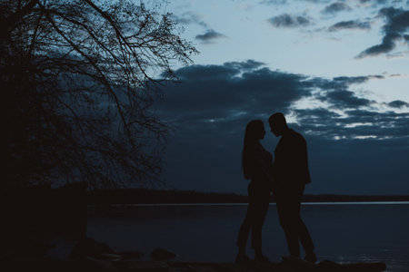 boyfriend and girlfriend hugging in the summer on the beachの写真素材