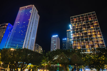 Skyscrapers of hotels in center of the waterfront in Nha Trang city at night. Nha Trang, Vietnam - July 24, 2024のeditorial素材