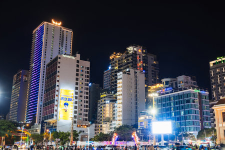 Skyscrapers of hotels near central Thap Tram Huong Tower Square in Nha Trang city at night. Nha Trang, Vietnam - July 24, 2024のeditorial素材