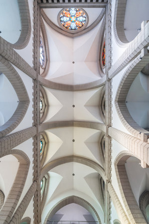 interior inside of Christian Catholic Polish church with beautiful white ceilings. Sacred Heart of Jesus Cathedral. Tashkent, Uzbekistan - April 18, 2024のeditorial素材