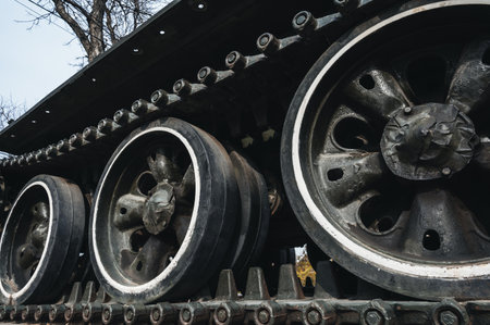 metal caterpillar track of old Soviet military tank in close-up