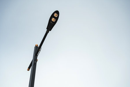 Street lamps with blue sky in backgroundの写真素材