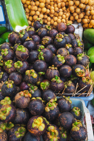 Mangosteen on counter in a store in Thailand at a street marketの写真素材