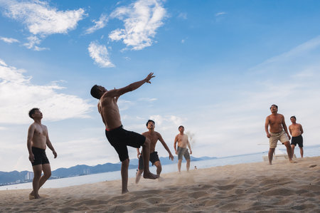 People play beach volleyball on beach in summer in Asia in Vietnam. Nha Trang, Vietnam - August 4, 2024のeditorial素材