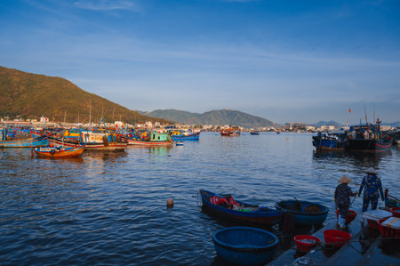Vietnamese fishing boats and ships in harbor at sea at fishing port in Nha Trang in Vietnam. Nha Trang, Vietnam - September 8, 2024のeditorial素材