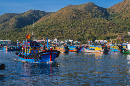 Vietnamese fishing boats, ships and vessels at fishing seaport Vinh Truong on river in Nha Trang in Vietnam. Nha Trang, Vietnam - September 8, 2024のeditorial素材