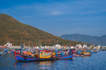 Vietnamese fishing boats, ships and vessels at fishing seaport Vinh Truong on river in Nha Trang in Vietnam. Nha Trang, Vietnam - September 8, 2024のeditorial素材
