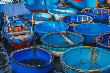 Traditional Vietnamese fishing boats baskets at fishing seaport on the river in Nha Trang. Nha Trang, Vietnam - September 8, 2024のeditorial素材