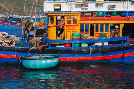 A traditional wooden Vietnamese fishing vessel is a ship on a river in sea bay in Vietnam. Nha Trang, Vietnam - September 8, 2024のeditorial素材