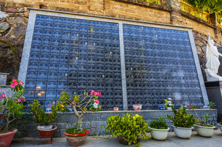 Tombstones of deceased Vietnamese near the Christ the King Cathedral also called Nha Trang Cathedral or Stone Church. Nha Trang, Vietnam - August 22, 2024のeditorial素材