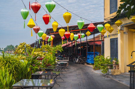 street on the river embankment in old town in Hoi An city in Vietnam decorated with traditional Vietnamese lanternsの写真素材
