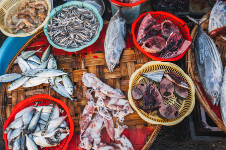 assortment of sea fish and seafood on counter in the fish market in Asia in Vietnamの写真素材