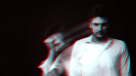 Abstract blurry portrait of a psychopathic man with schizophrenic diseases and split personalityの写真素材