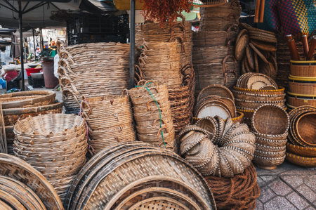 Traditional vietnamese rattan woven wicker baskets on the counter at Asian street market in Vietnam