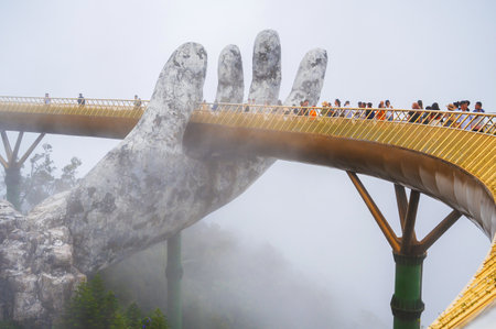 Golden Bridge is also known as the Hands of God in Ba Na Hills Park in Da Nang on mountain in the fog. Da Nang, Vietnam - September 13, 2024のeditorial素材