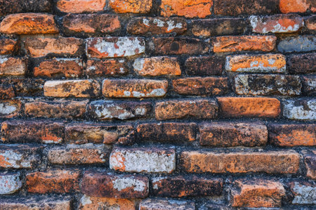 Texture of ancient old antique orange brick wall close upの写真素材