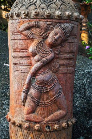 sculpture statue of female deity on a Buddhist pagoda in Asia in Vietnam