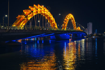 Dragon Bridge over Han River is famous landmark in city of Da Nang in Vietnam at nightの写真素材