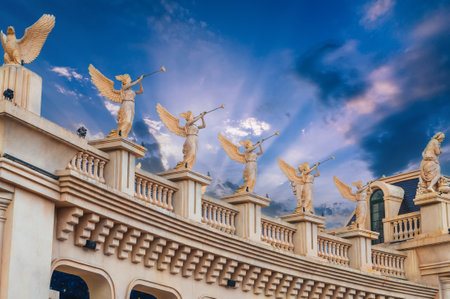 Beautiful statues and sculptures adorn walls of a medieval castle in Ba Na Hills Park in Da Nang in Vietnamの写真素材