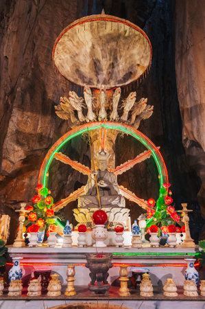 Buddhist temple with statues and sanctuary inside Am Phu Cave in Marble Mountains in Da Nang in Vietnam in Asiaの写真素材
