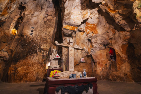 Buddhist statue scales inside Asian sacred temple in the Am Phu Cave in the Marble Mountains in Da Nang in Vietnam in Asia. Da Nang, Vietnam - September 12, 2024のeditorial素材