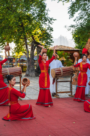 Vietnamese women in traditional red dress dance at the Po Nagar Cham Towers in Nha Trang. Nha Trang, Vietnam - August 8, 2024のeditorial素材