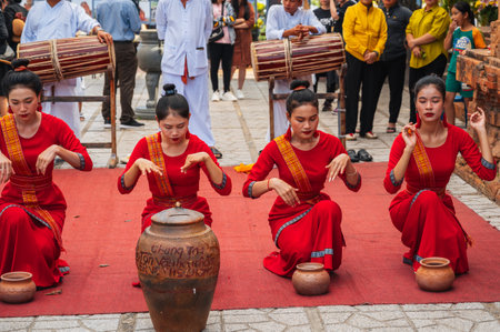 Young Vietnamese women in traditional dress in Po Nagar Cham Towers in Nha Trang . Nha Trang, Vietnam - August 8, 2024のeditorial素材