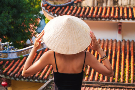 back of a woman tourist traveler at temple on the Buddhist pagoda in Da Nang in Vietnam. Travel and tourism in Asiaの写真素材