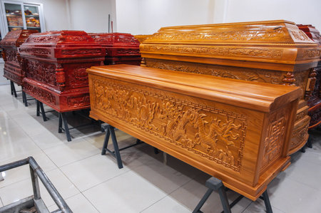 wooden coffins with traditional Asian ornament in funeral home in Asiaの写真素材