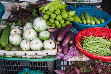 assortment of various vegetables at street vegetable market in Asiaの写真素材