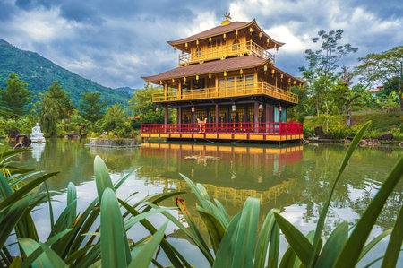 Beautiful Asian Buddhist Temple on the water on lake at Vietnamese Nghia Son Pagoda in mountains in Nha Trang in Vietnam in Asiaの写真素材