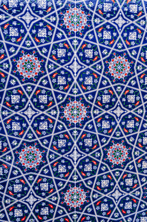 ceramic tiles with traditional Uzbek oriental pattern in Uzbekistan. Blue floral background with Islamic ornamentの写真素材