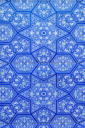 ceramic tiles with traditional Uzbek oriental pattern in mosaic in Uzbekistan. Blue mosaic with...