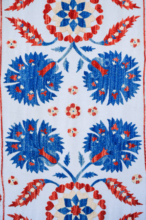 A traditional Uzbek geometric pattern on ancient carpet in Uzbekistan. Oriental white background...