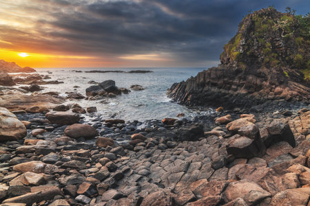 Panorama of volcanic basalt columns Ganh Da Dia on beach by the sea. Landscape with Da Dia reef in Vietnam at sunriseの写真素材