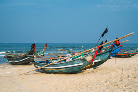 Traditional wooden Vietnamese boats on the beach by sea in a fishing village in Vietnam