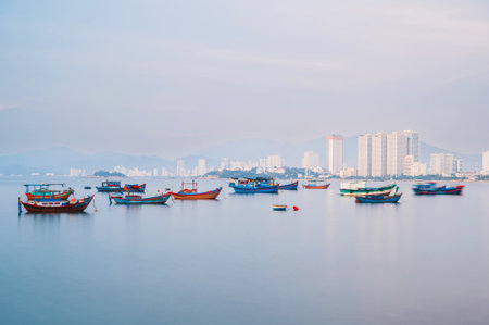 Traditional Vietnamese fishing boats at sea in Nha Trang city in Vietnam in Asiaの写真素材