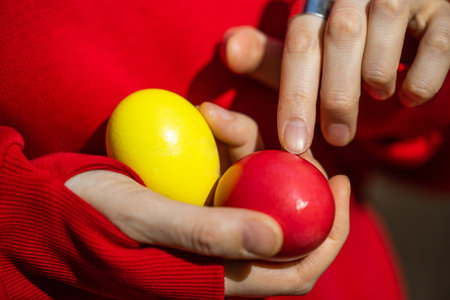 A person delicately holds a fragile egg in their hands, showcasing the fragility and beauty of life.