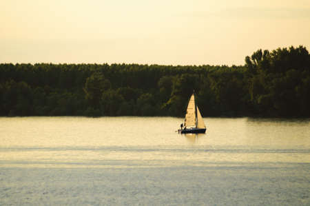 Sailboat on a riverの写真素材
