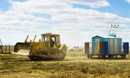 tractor pulling power station at the production site in the desertの写真素材