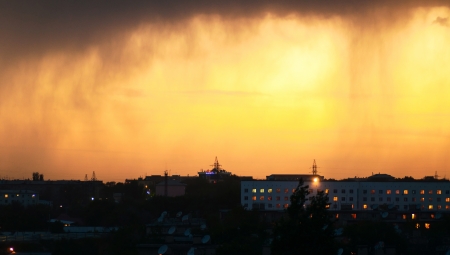 evening view of the city with rainy cloudsの写真素材
