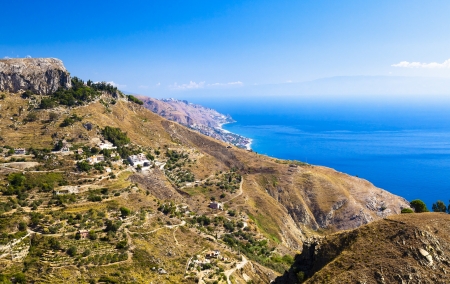 The beautiful green mountain coast on Sicilyの写真素材