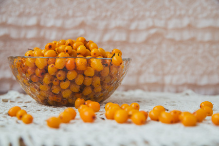 buckthorn on a handful of therapeutic knitted napkinの写真素材